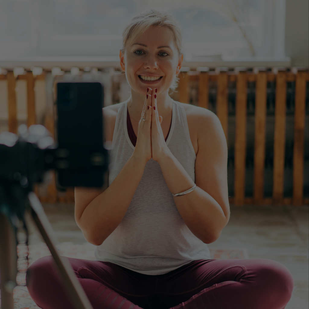 woman teaching yoga online